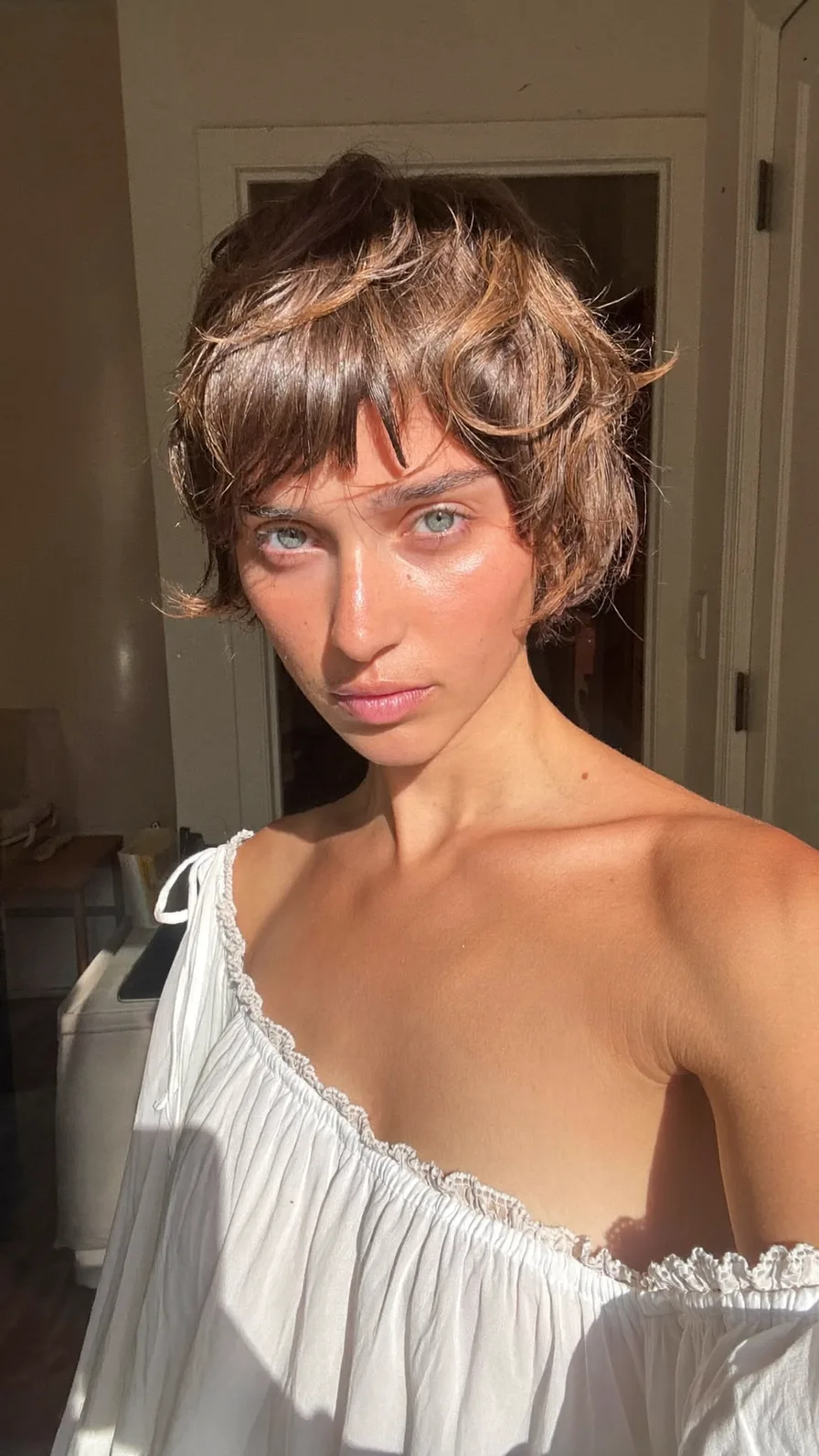Textured Choppy Pixie Cut with Blunt Honey Highlighted Bangs