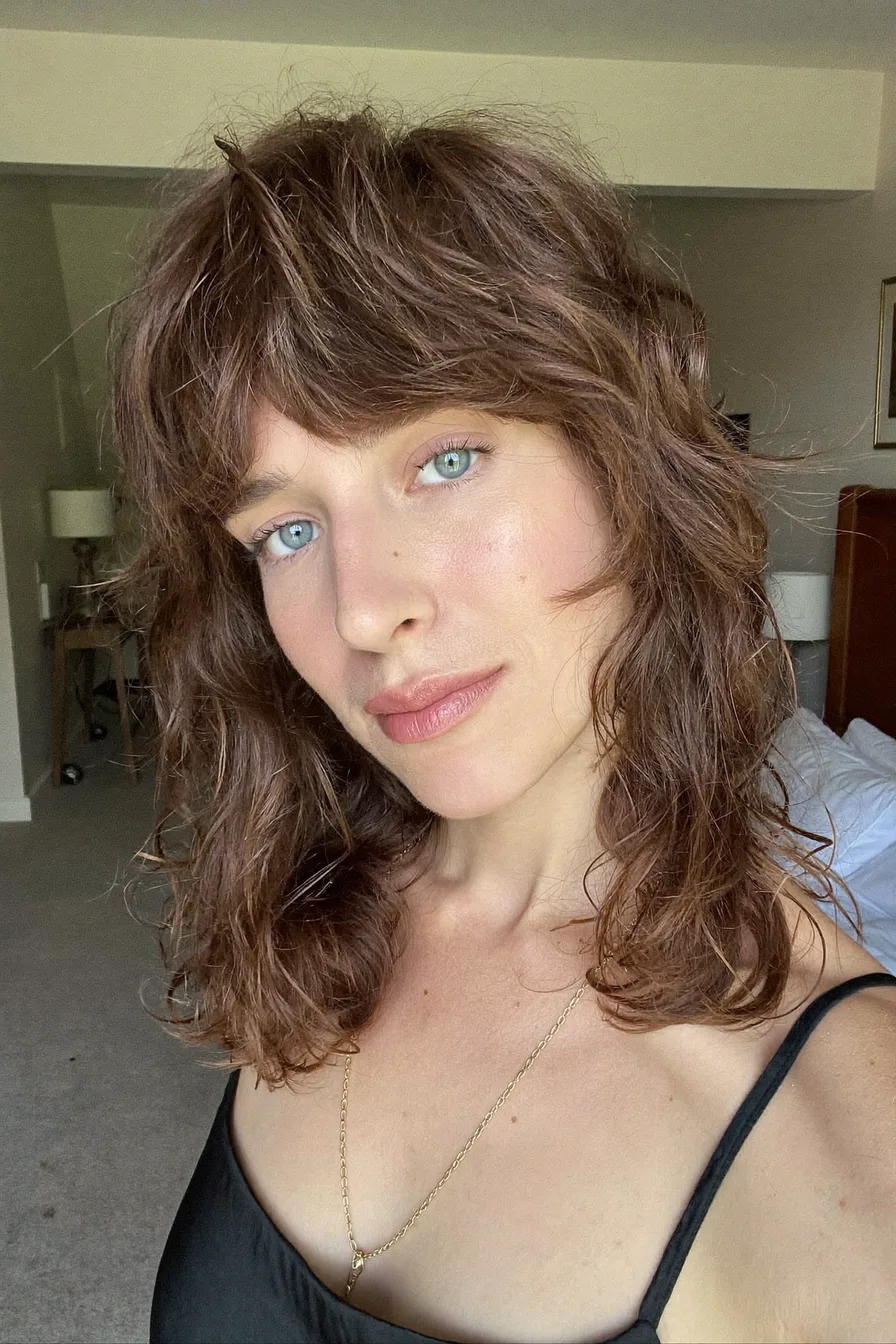 Textured Shoulder-Length Chestnut Brown Shag with Curtain Bangs
