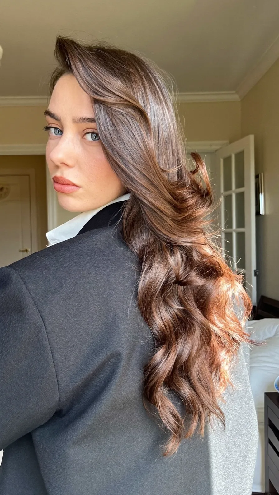 Voluminous Long Layered Chestnut Brown Waves with Side Part