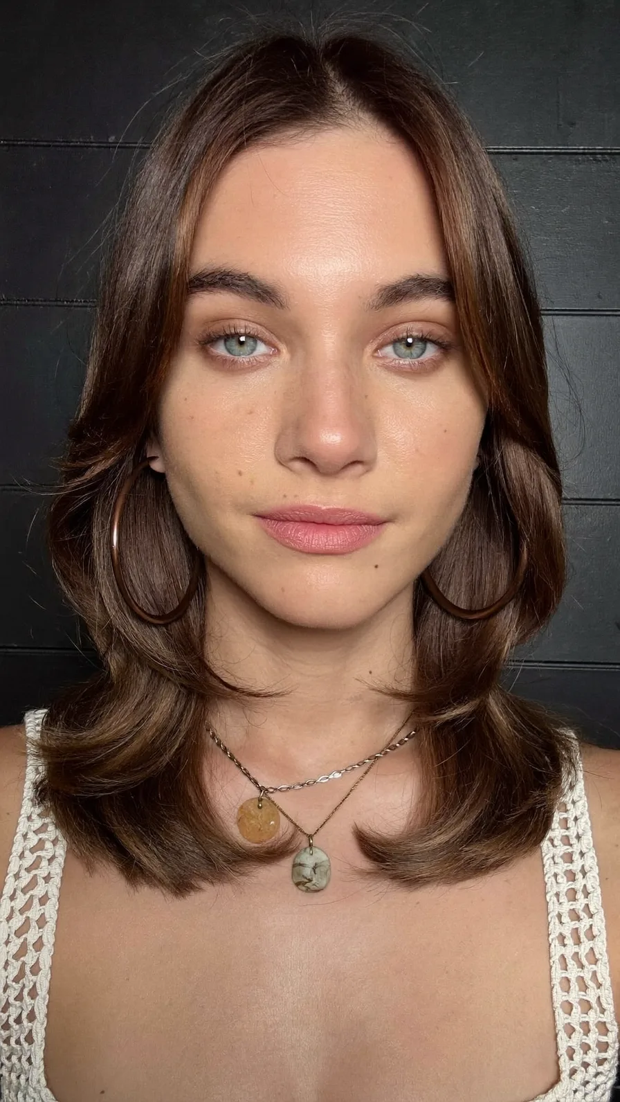Soft Feathered Shoulder-Length Layers with Center Curtain Bangs