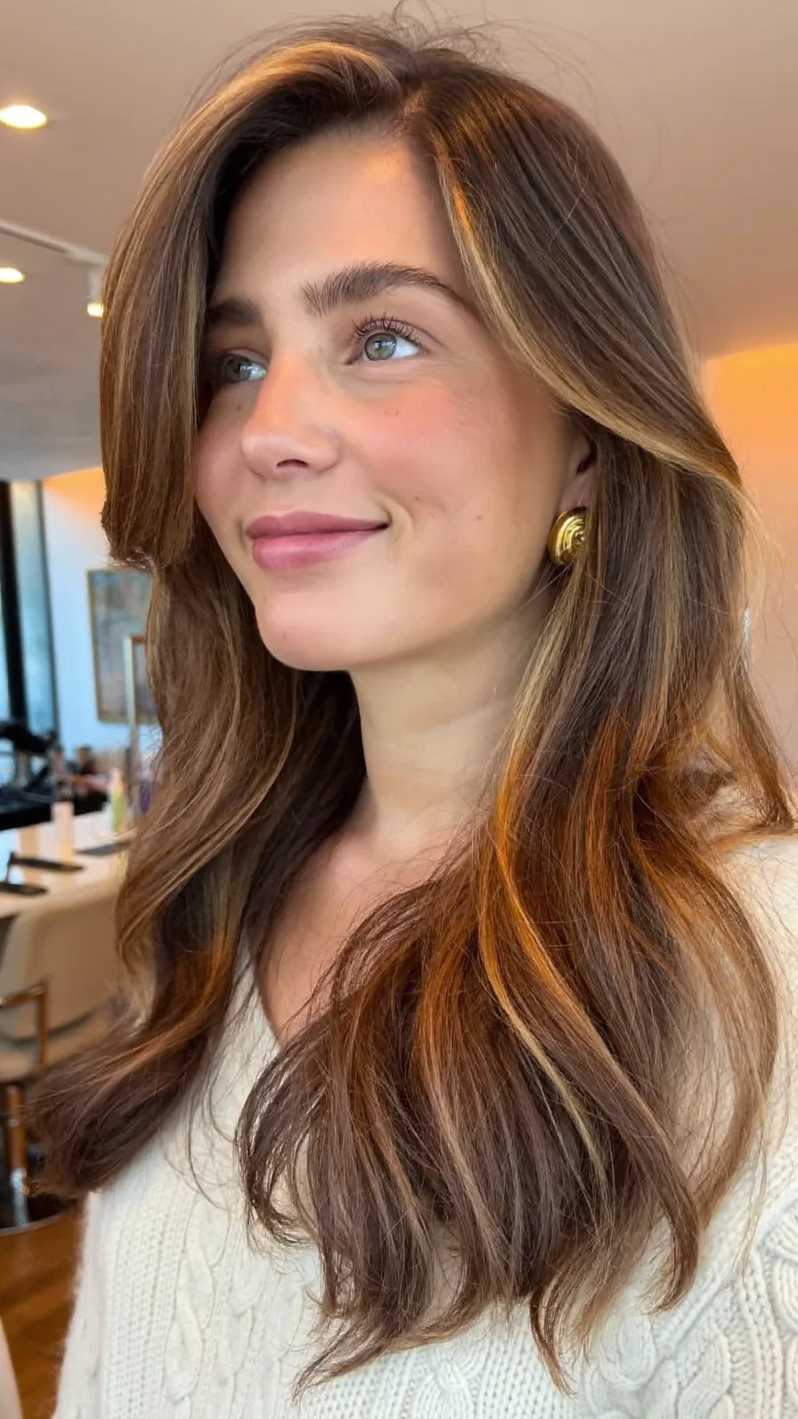 Flowing Medium Layered Hair with Warm Balayage Curtain Bangs