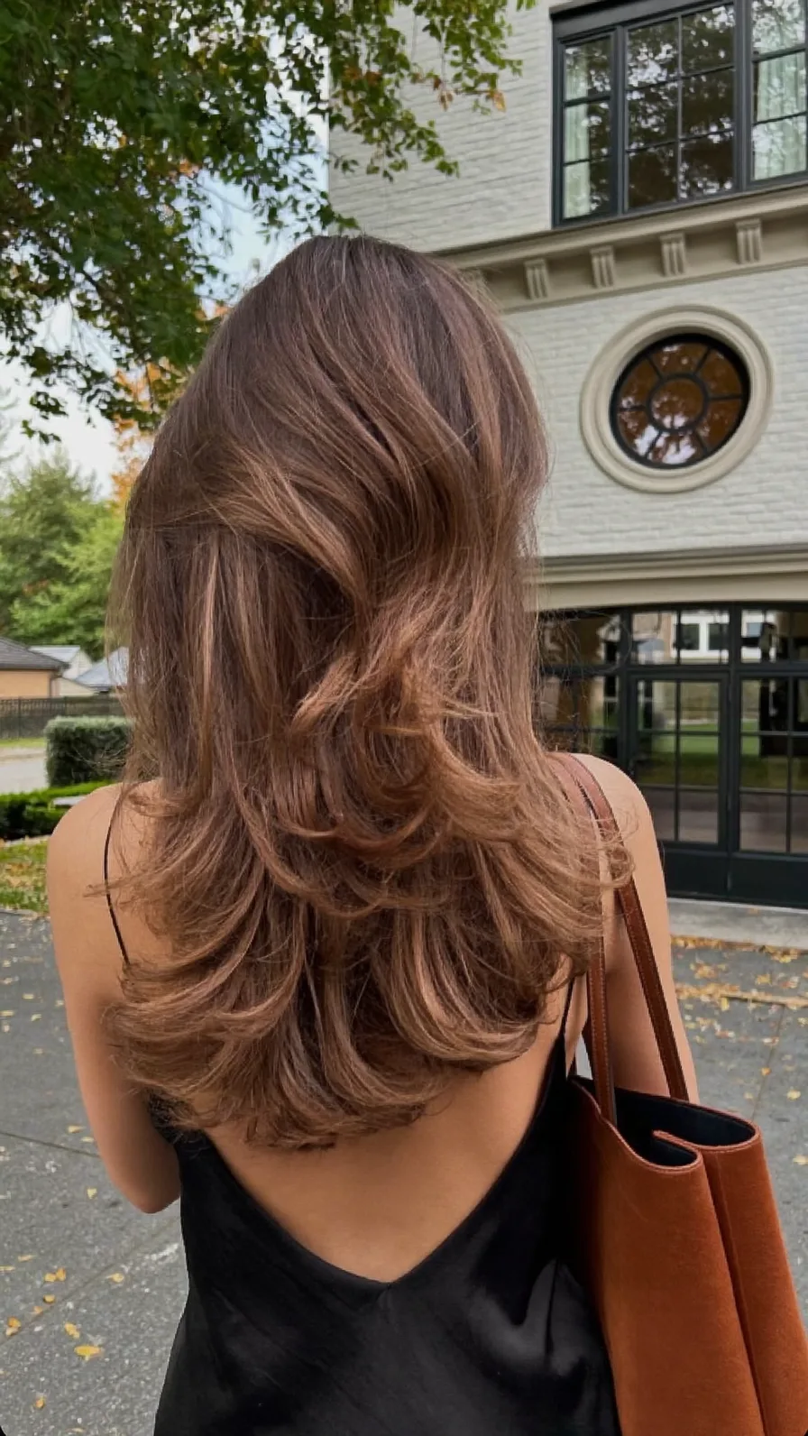 Voluminous Chestnut Brown Flowing Long Layers Hairstyle