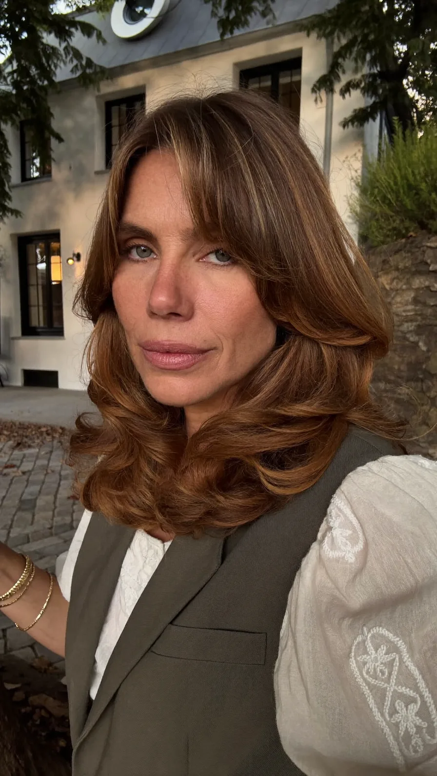 Voluminous Layered Medium Hair with Curtain Bangs and Balayage