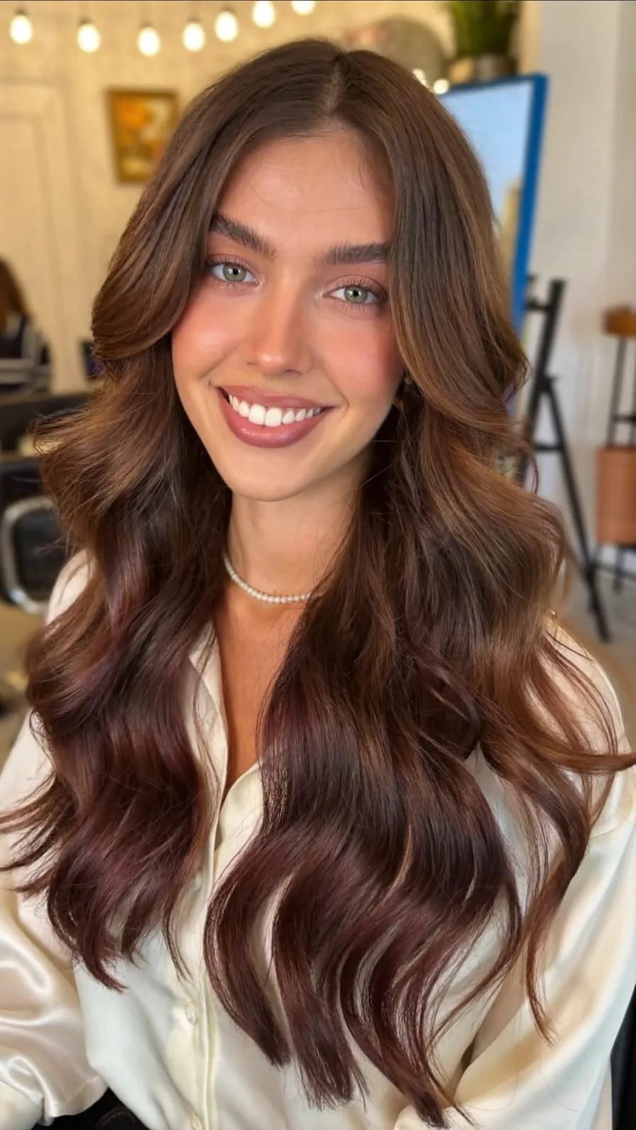 Long Layered Chestnut Waves with Soft Curtain Bangs