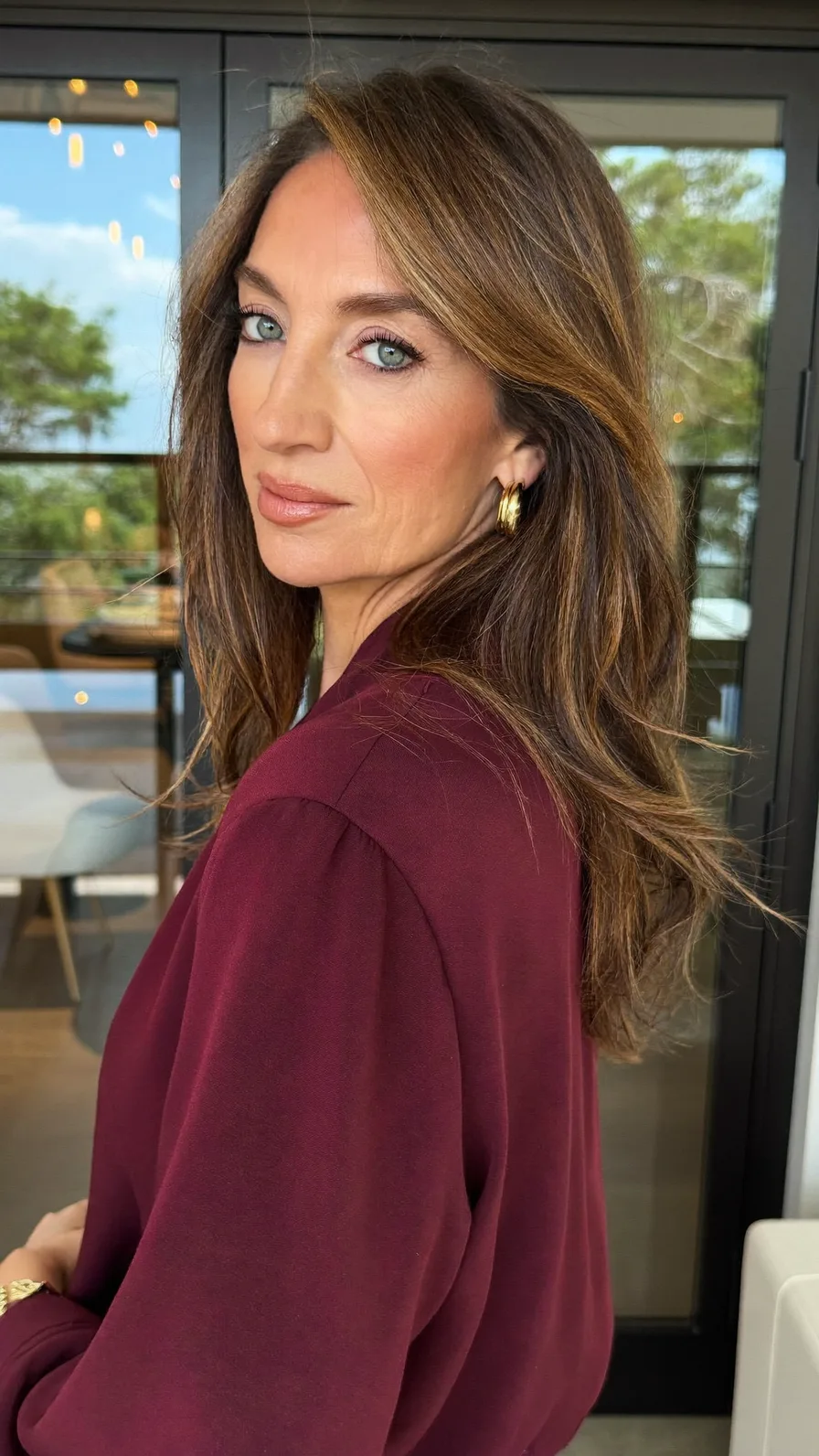 Elegant Medium Length Wavy Layers with Side-Swept Highlights