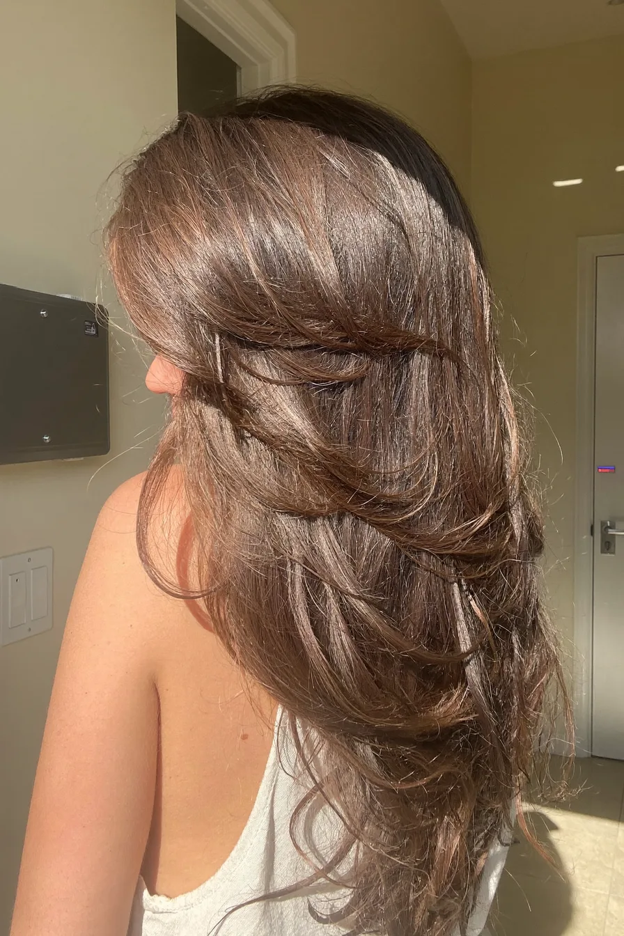 Voluminous Wavy Long Layers with Soft Feathered Ends