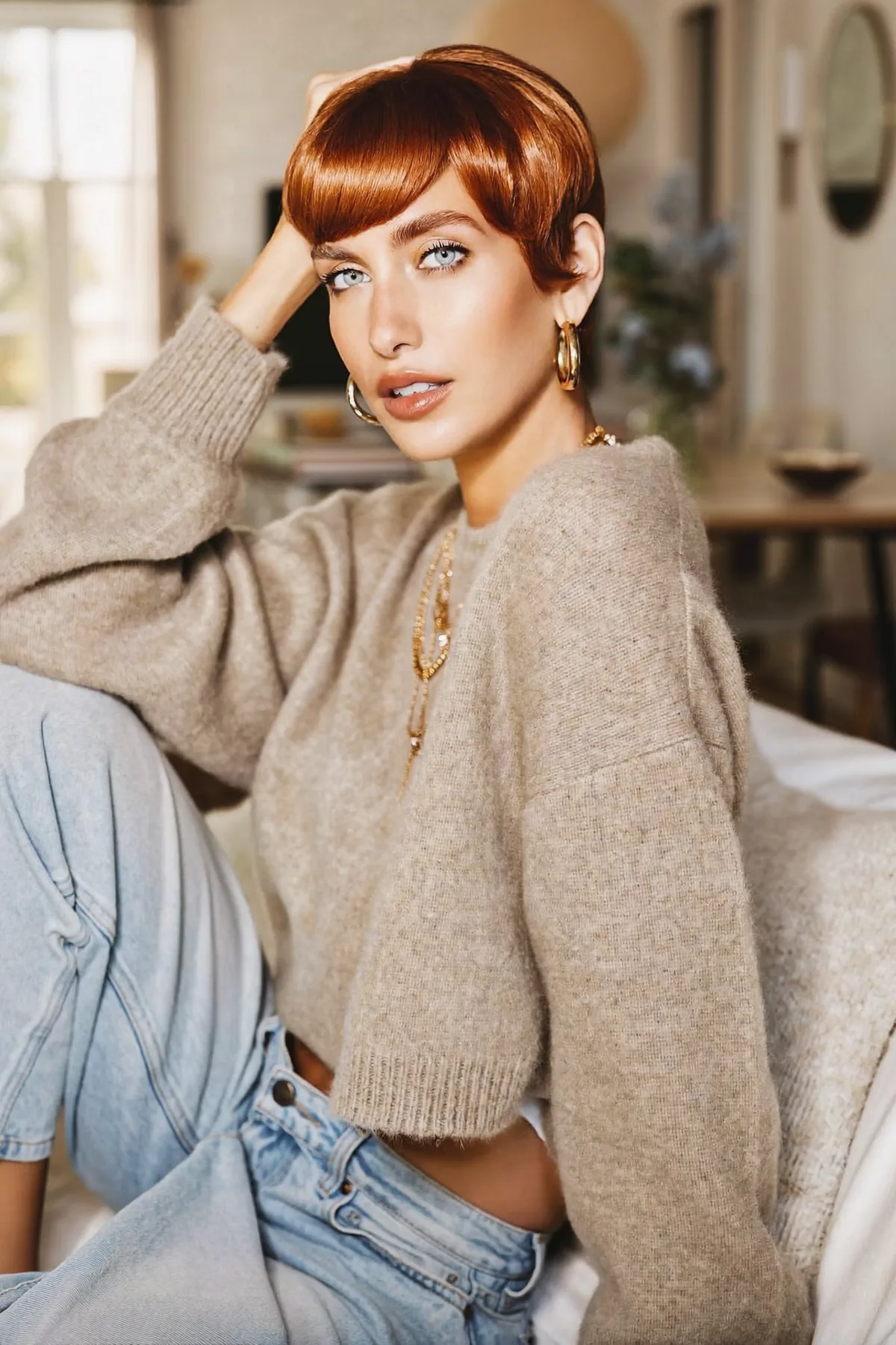 Sleek Strawberry Blonde Pixie Cut with Full Fringe Bangs