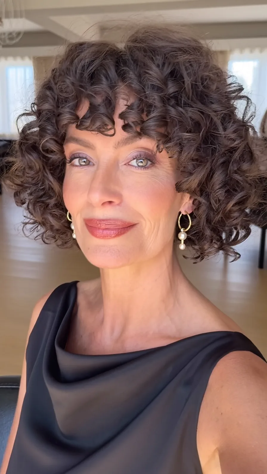 Voluminous Chin-Length Curly Bob with Natural Curly Bangs