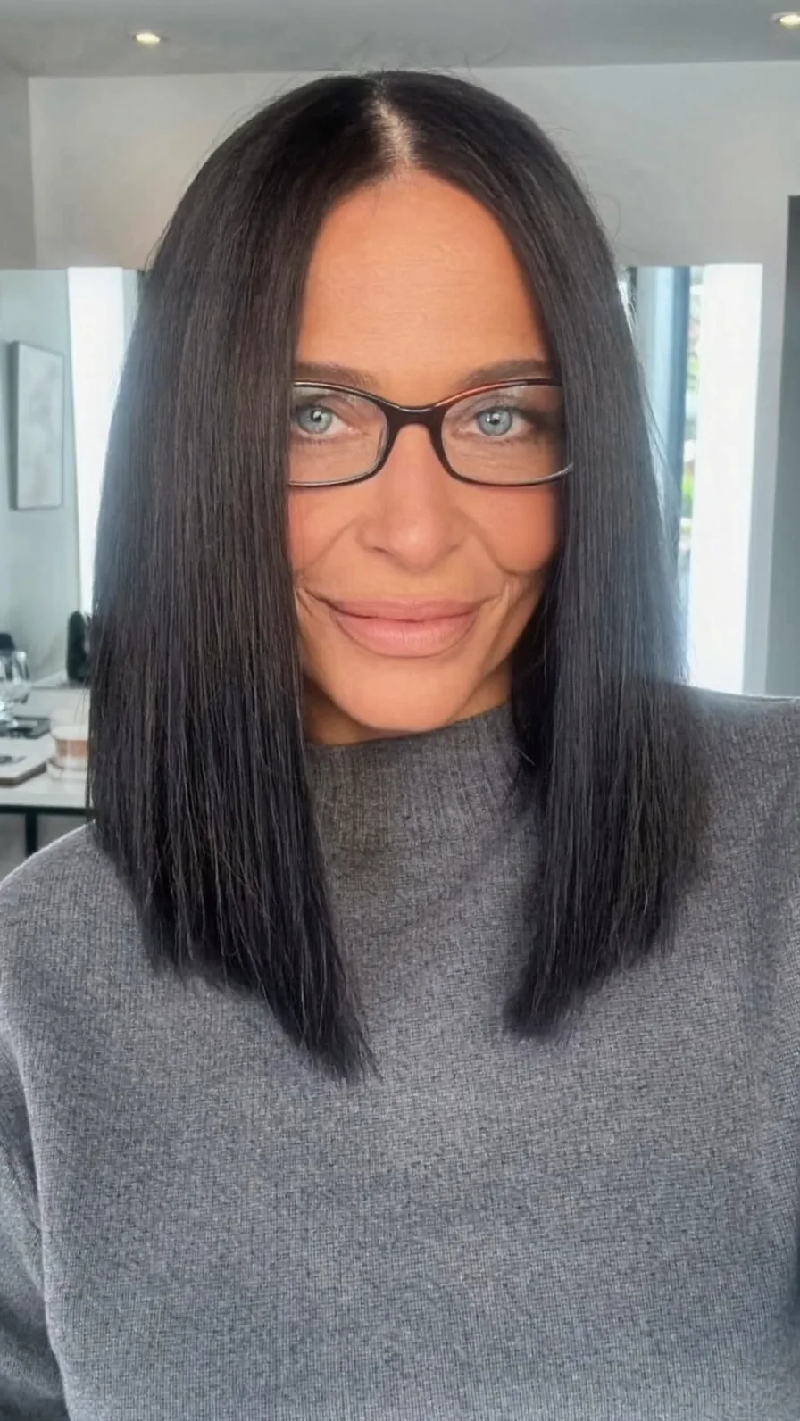 Sleek Shoulder-Length Blunt Cut Lob with Center Parting