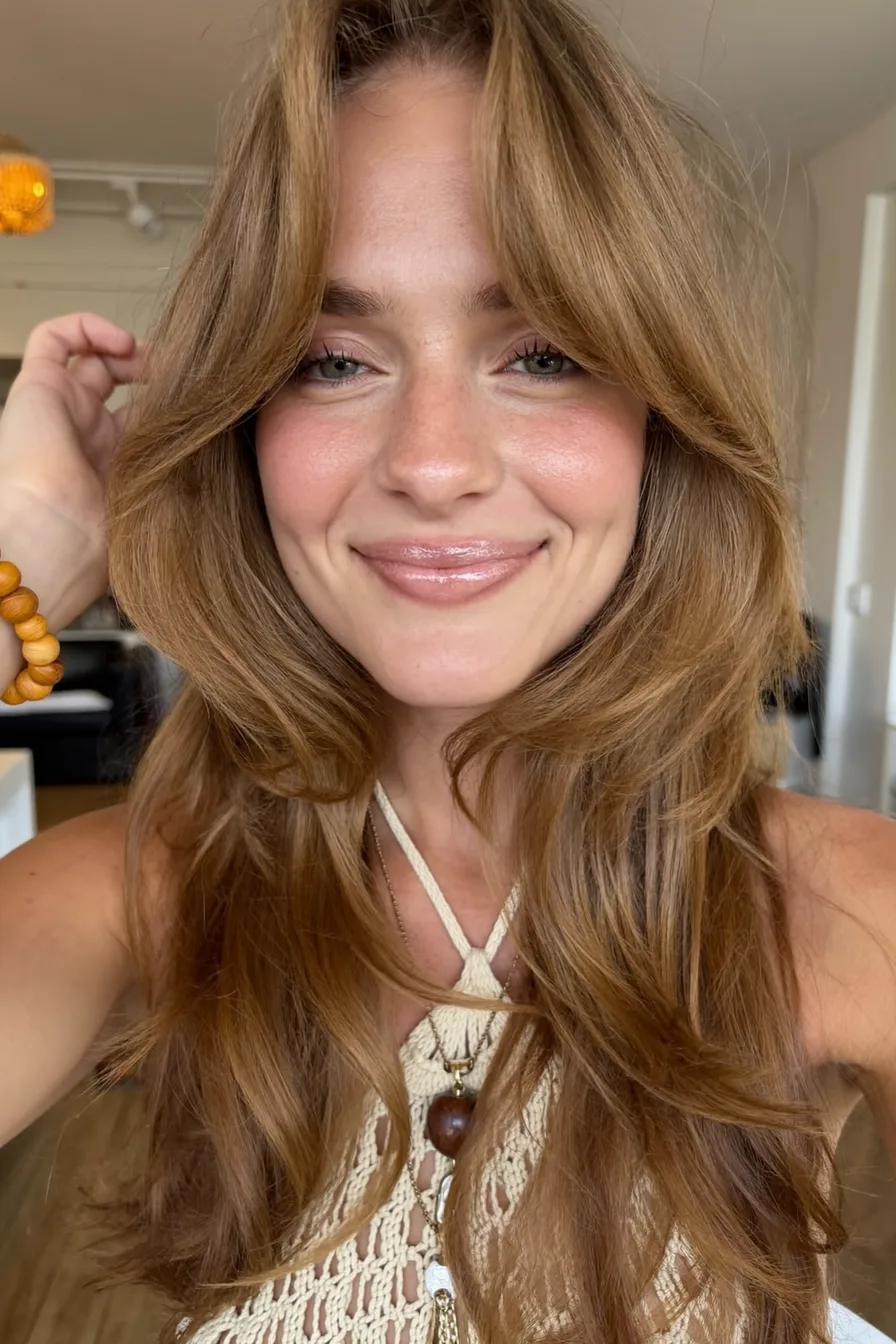 Voluminous Layered Chestnut Brown Shoulder-Length Haircut with Curtain Bangs