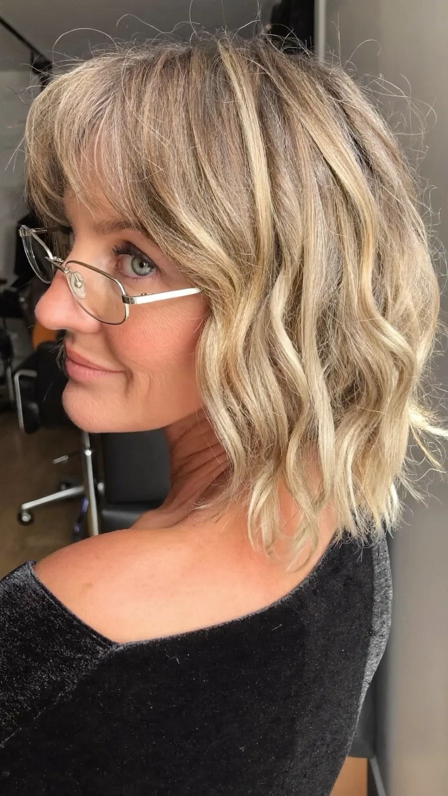 Textured Wavy Lob with Wispy Bangs and Multi-Dimensional Highlights
