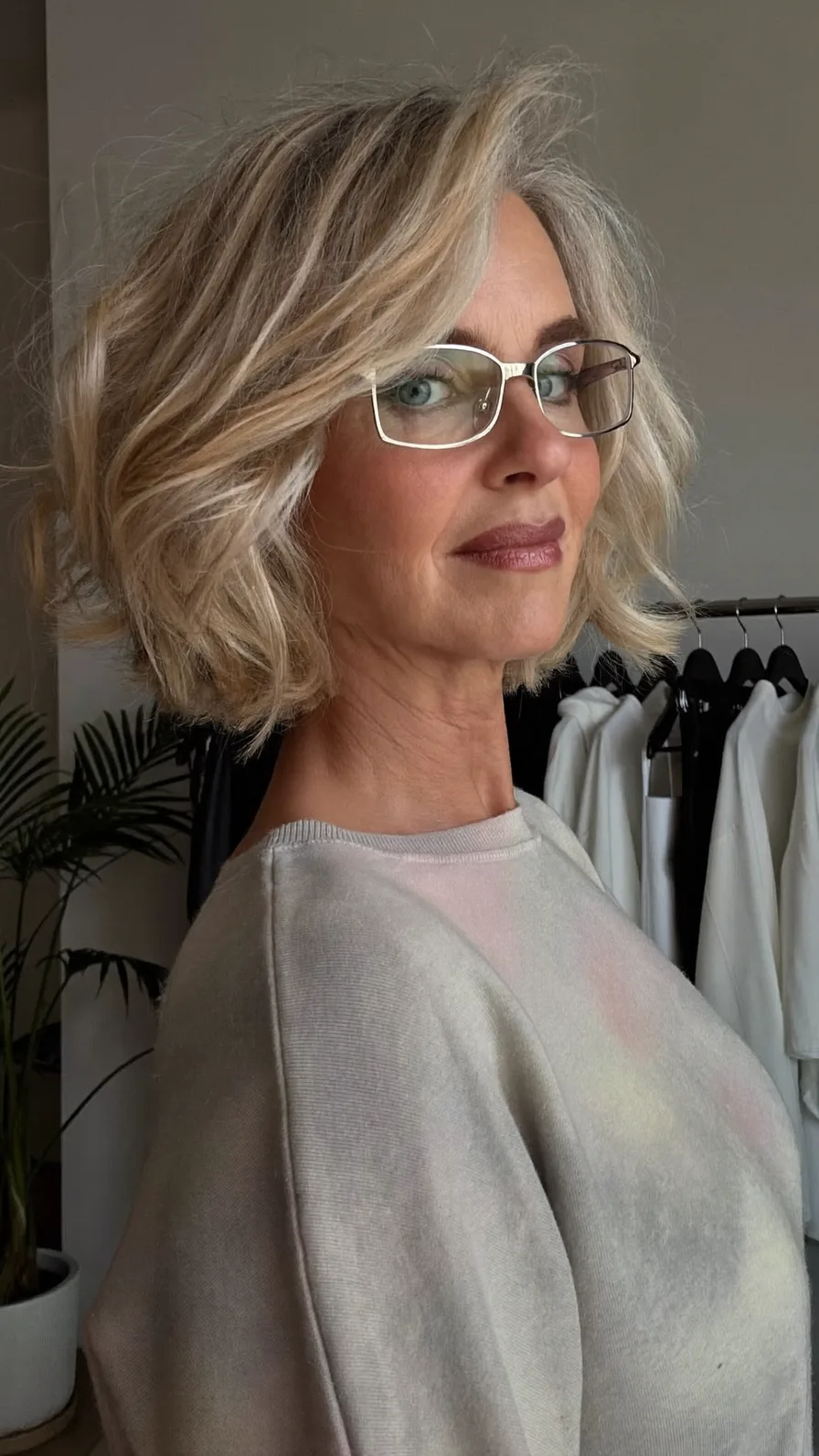 Chin-Length Layered Blonde Bob with Textured Side-Swept Bangs