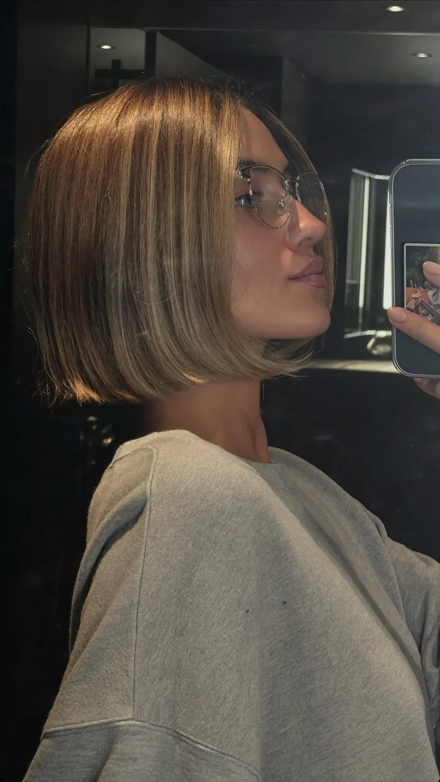 Sleek Chin-Length Blunt Bob with Warm Caramel Highlights