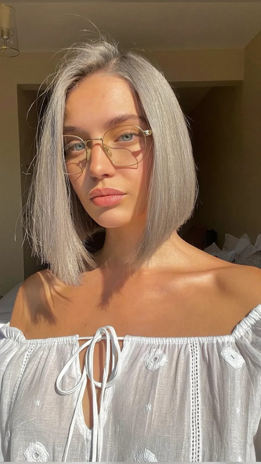 Sleek Platinum Silver Chin-Length Bob with Center Part