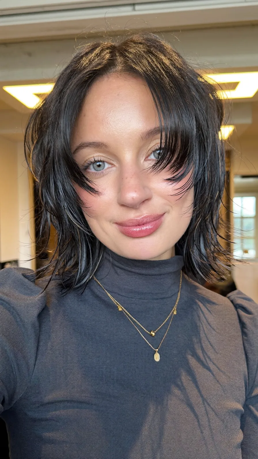 Chic Textured Chin-Length Bob with Curtain Bangs