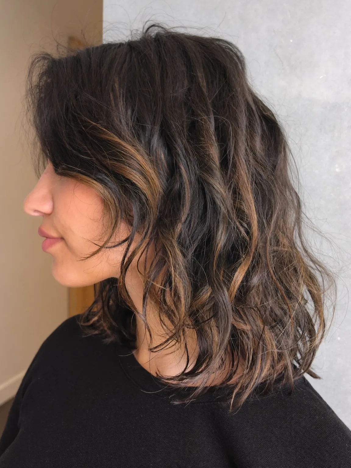 Shoulder-Length Wavy Lob with Side-Swept Bangs and Highlights