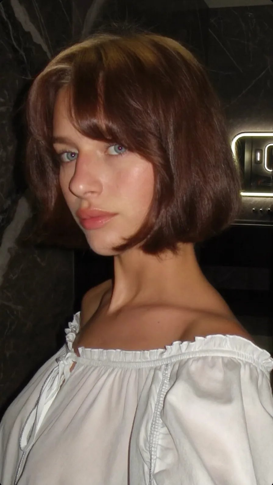 Classic Chin-Length Bob with Rounded Ends and Curtain Bangs