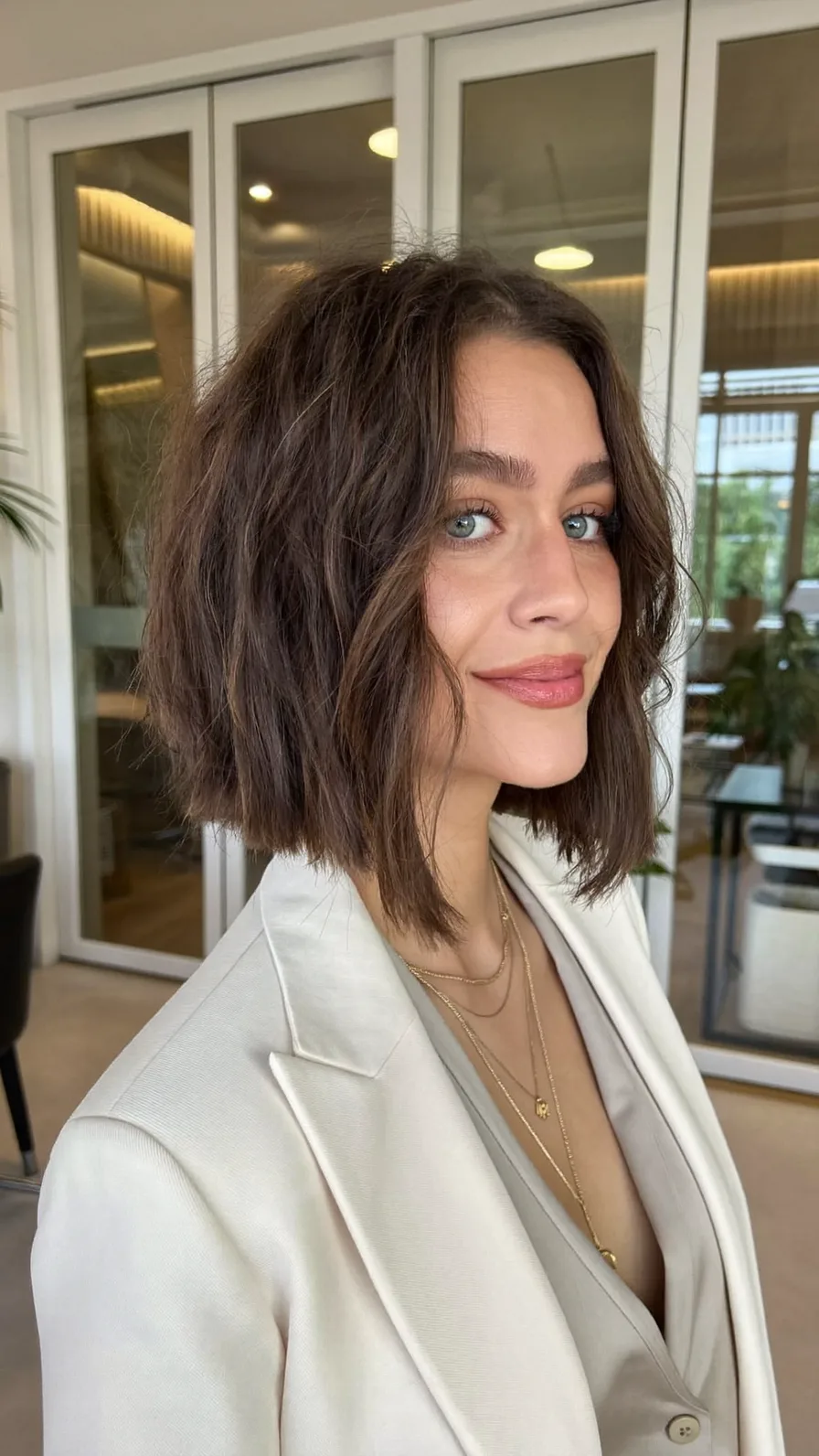 Chin-Length Textured Bob with Curtain Bangs for Volume