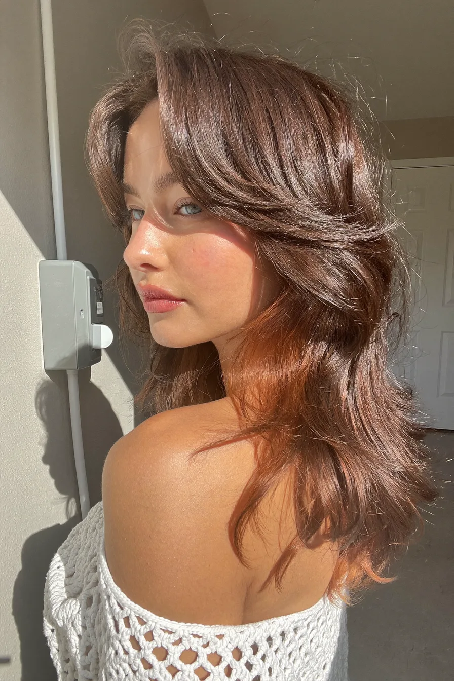 Textured Layers with Face-Framing Bangs in Chocolate Brown