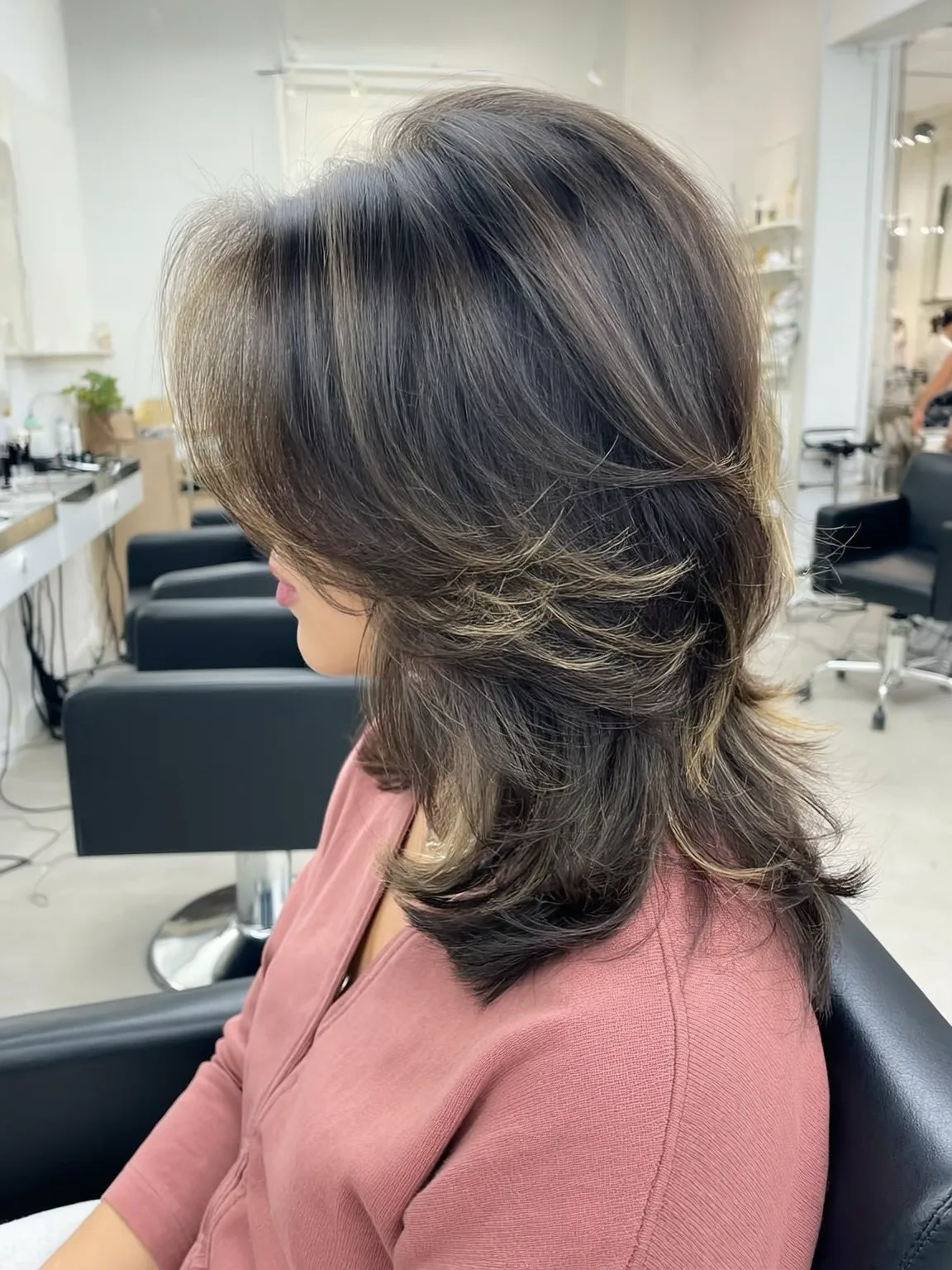 Medium Wavy Layered Cut with Subtle Chocolate Highlights