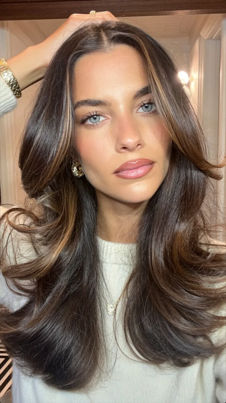 Long Layered Hair with Voluminous Curtain Bangs and Balayage