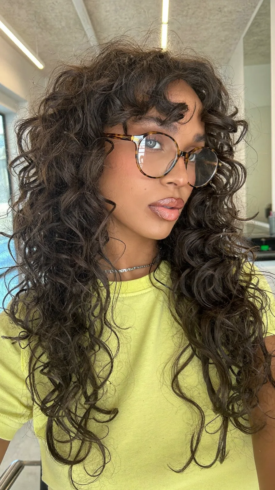 Voluminous Long Curly Hair with Center Curtain Bangs