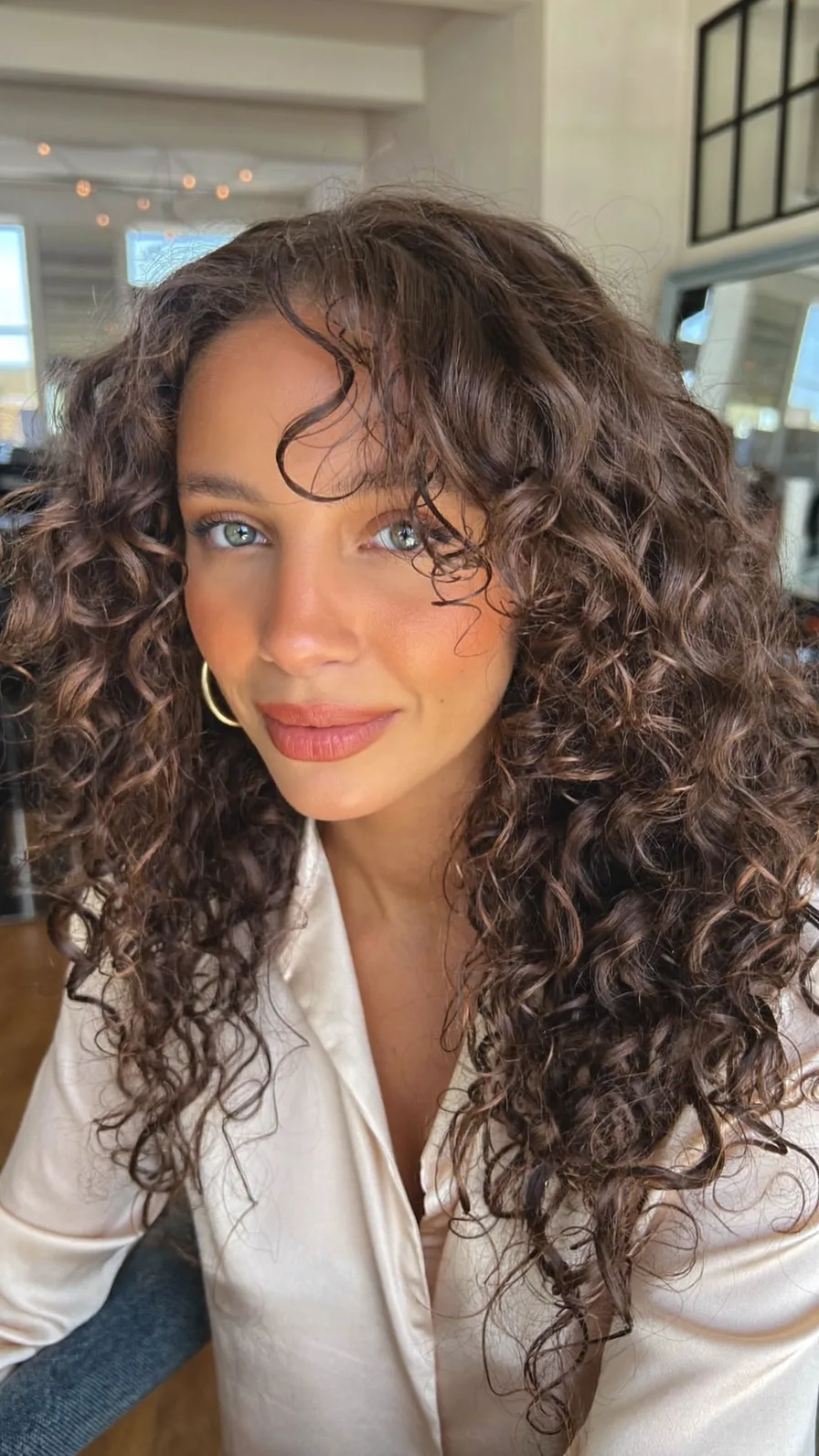 Voluminous Curly Long Layers with Center Curtain Bangs