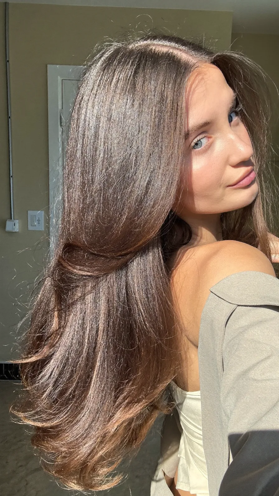 Sleek Long Layers with Soft Flicked Ends and Side Part