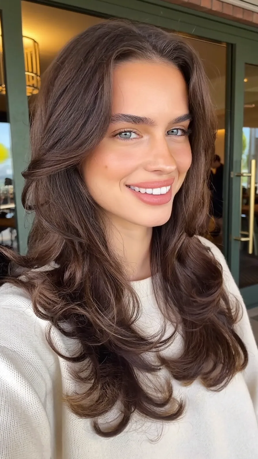 Elegant Long Layered Hair with Face-Framing Curtain Bangs