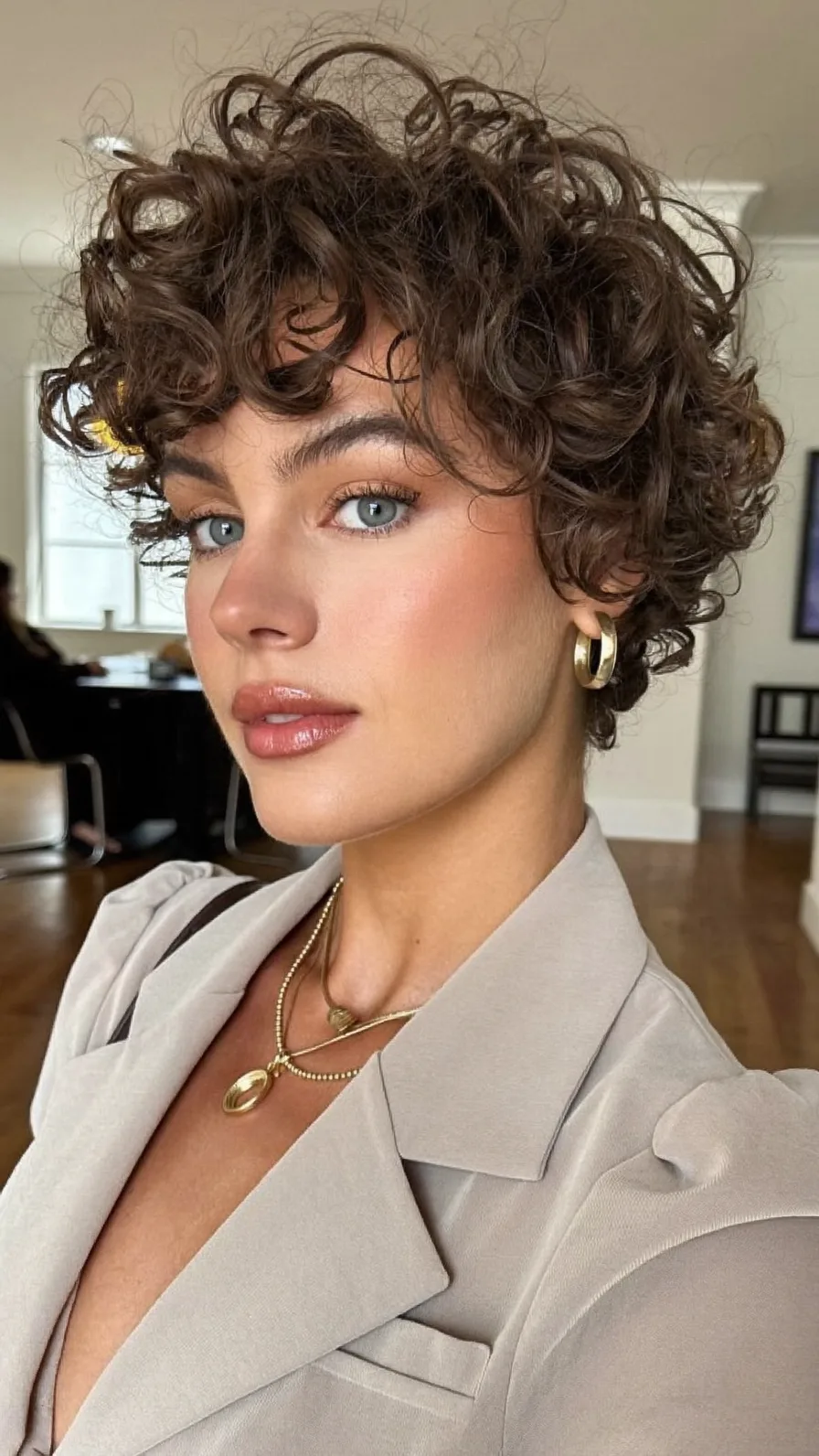 Voluminous Curly Pixie with Defined Curtain Bangs Style