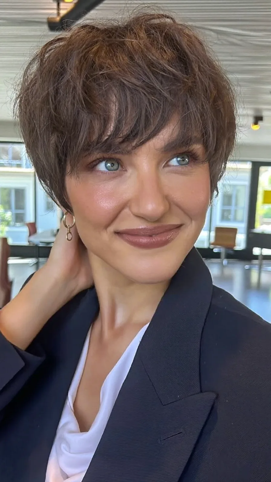 Voluminous Textured Pixie with Side-Swept Bangs