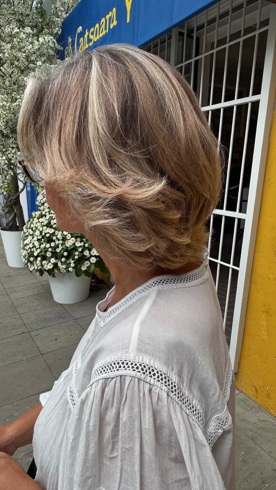 Elegant Ash Blonde Feathered Layers with Soft Highlights