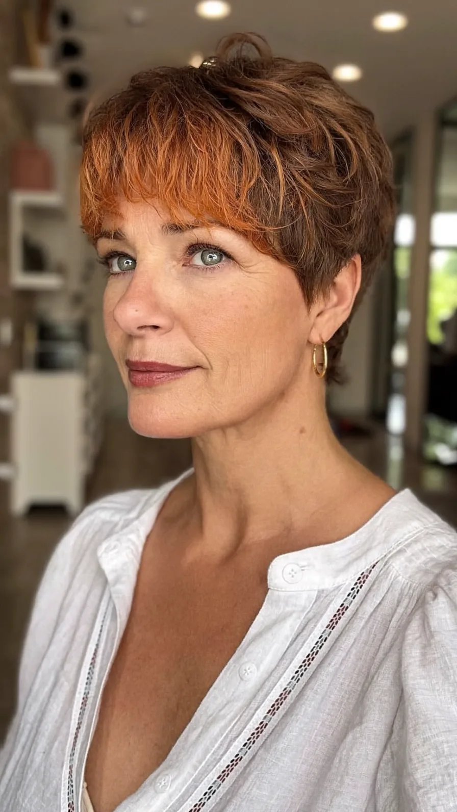 Modern Textured Pixie Cut with Wispy Copper Bangs