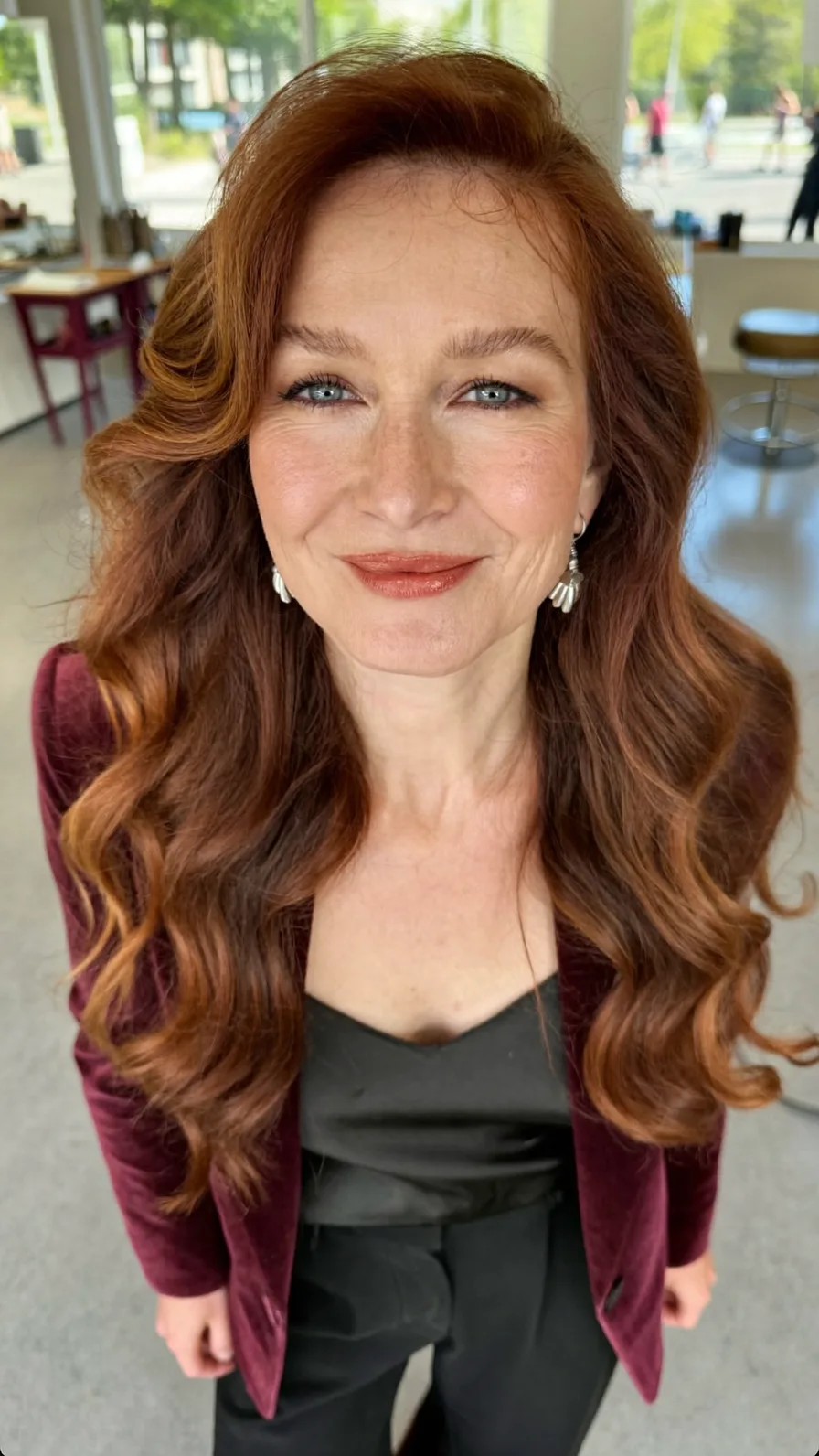 Voluminous Copper Long Layered Waves with Side-Swept Bangs