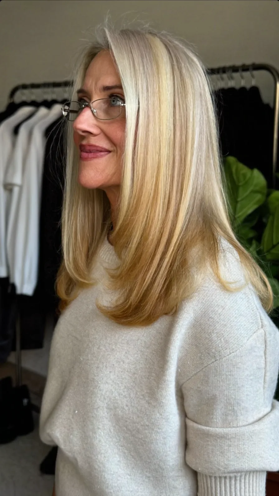 Elegant Medium-Length Layered Blonde with Soft Flicked Ends