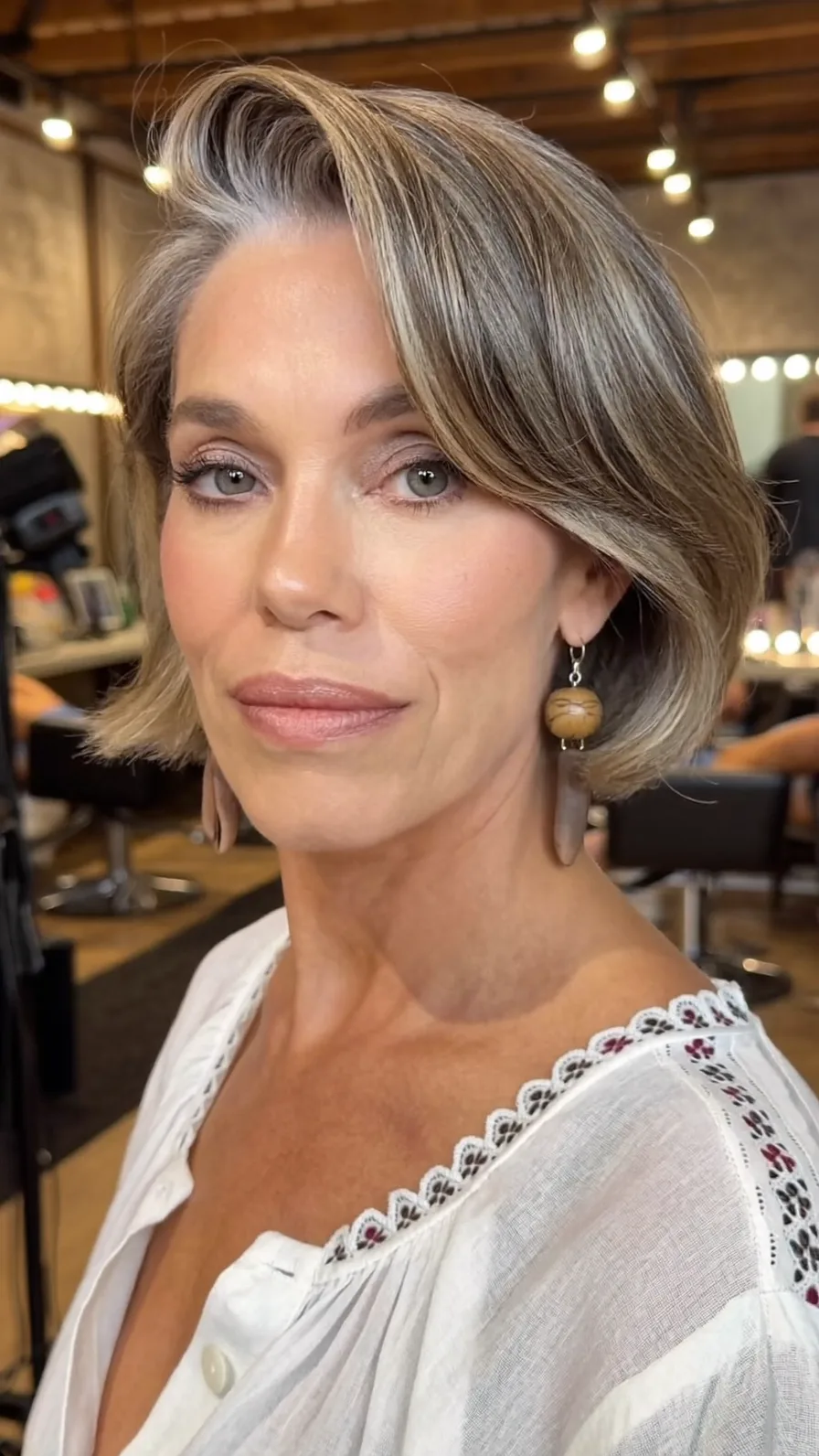 Chic Ash Blonde Rounded Bob with Side-Swept Bangs