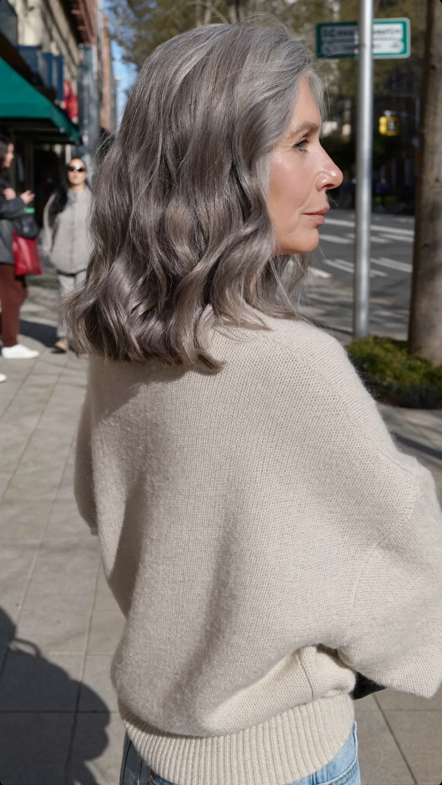 Elegant Shoulder-Length Wavy Silver Gray Hair with Side Part
