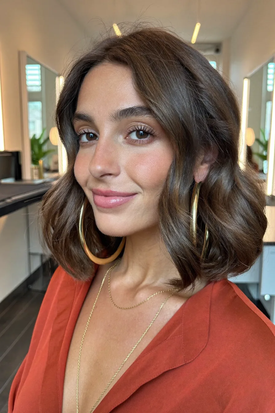 Chic Textured Chin-Length Bob with Flowing Center-Part Waves