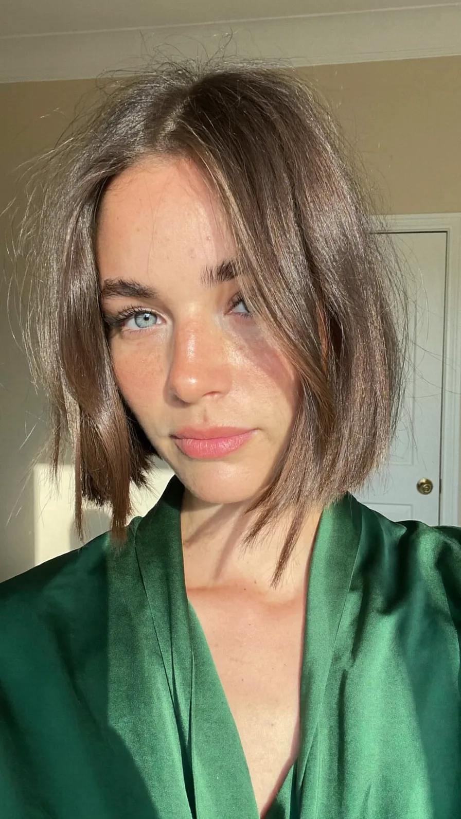 Chic chin-length blunt bob with natural curtain bangs
