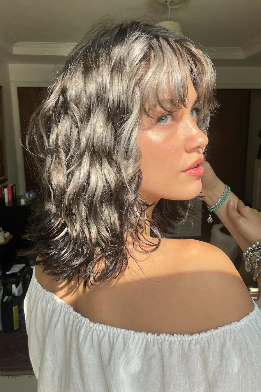 Textured Lob with Curtain Bangs and Multi-Dimensional Highlights