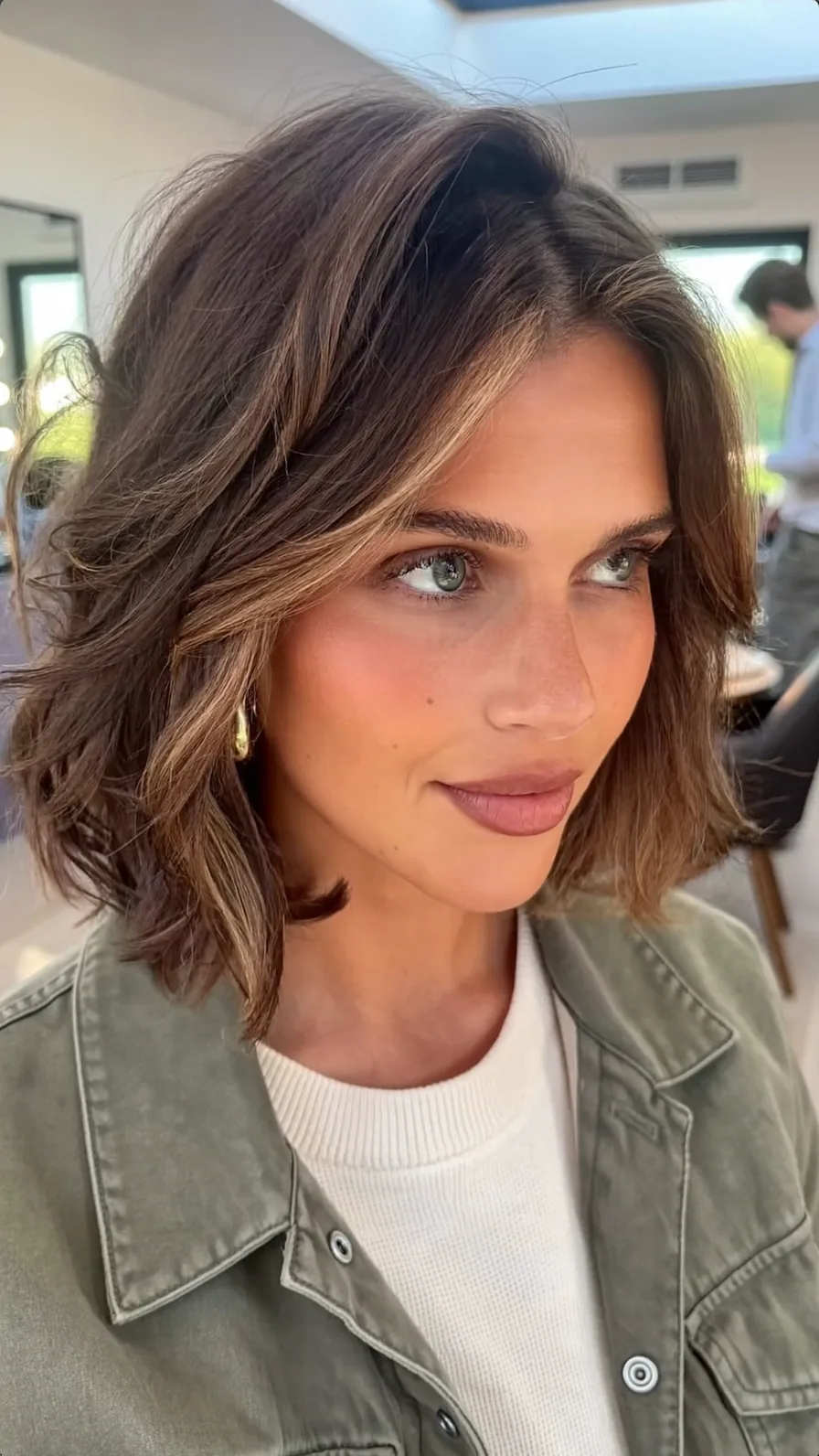 Soft Wavy Lob with Curtain Bangs and Caramel Balayage Highlights