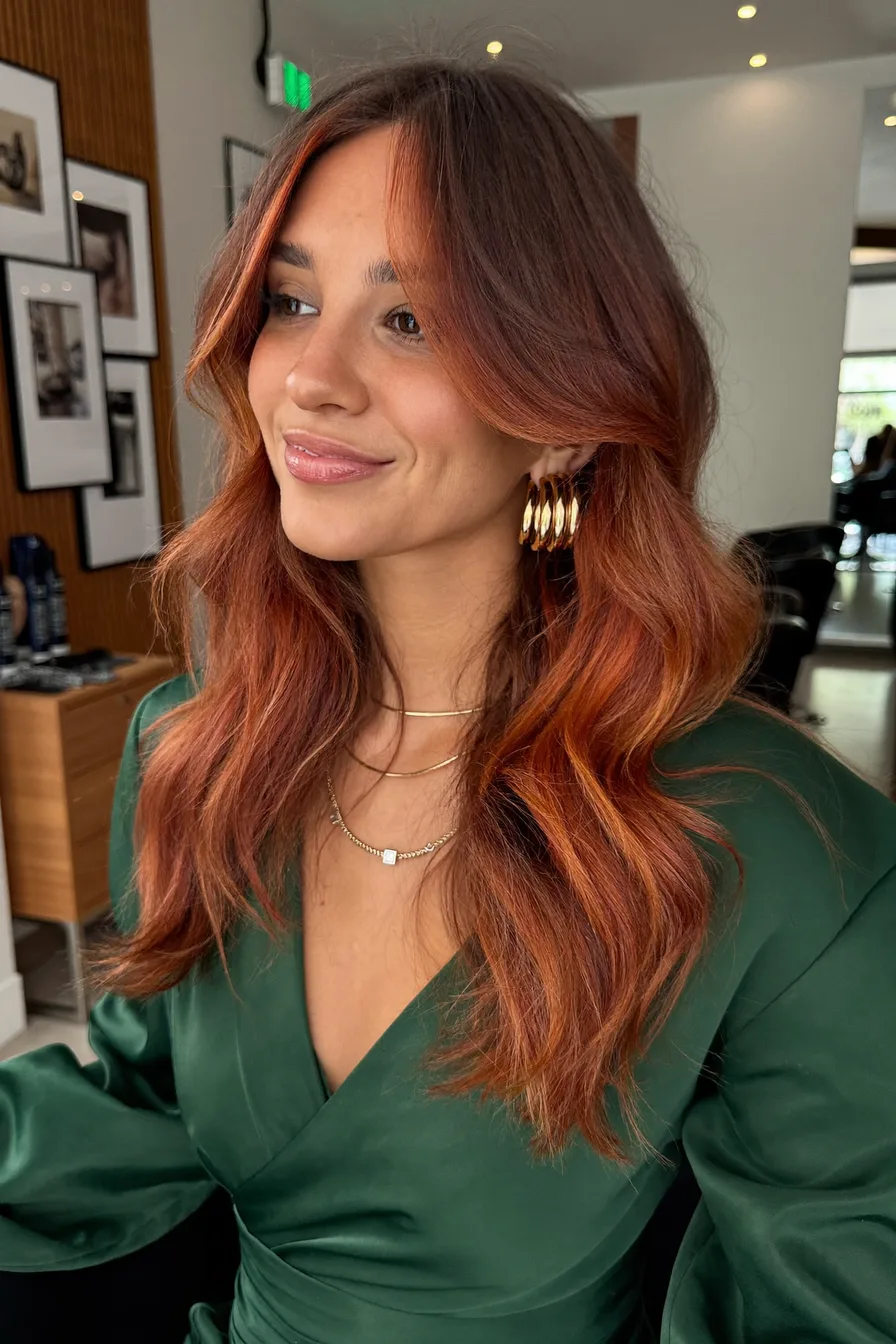 Voluminous Auburn Red Long Layered Waves With Soft Face Framing