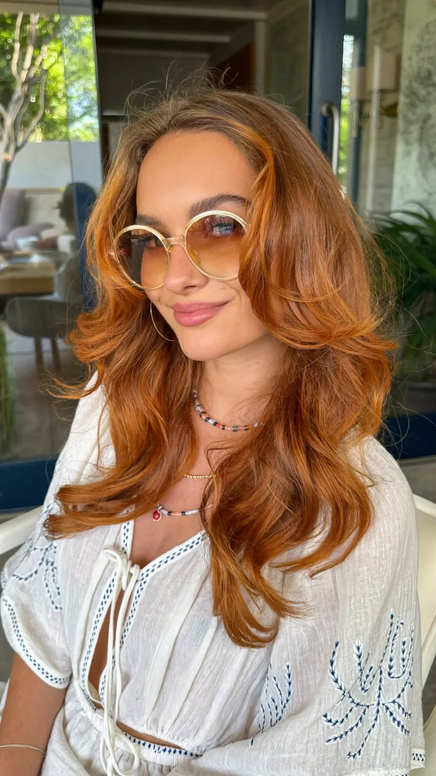 Voluminous Long Layers with Center Curtain Bangs and Flicked Ends