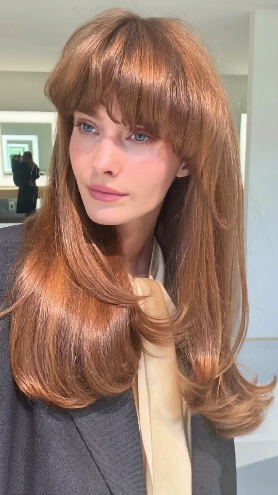 Long Layered Copper Hair with Flowing Curtain Bangs