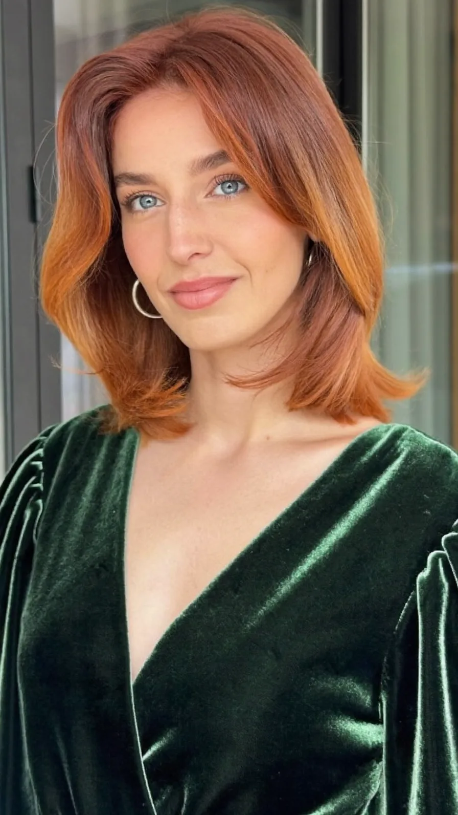 Modern Shoulder-Length Copper Layered Hair with Curtain Bangs