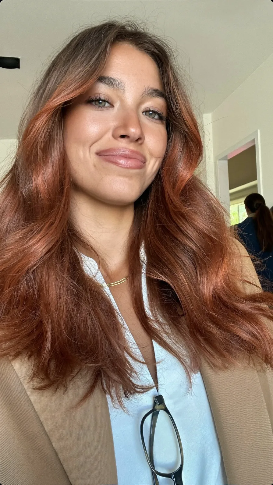 Voluminous Warm Copper Long Layers with Curtain Bangs