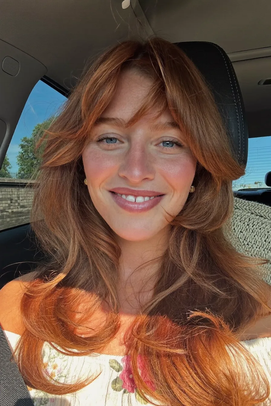 Flowing Long Layers with Center Curtain Bangs