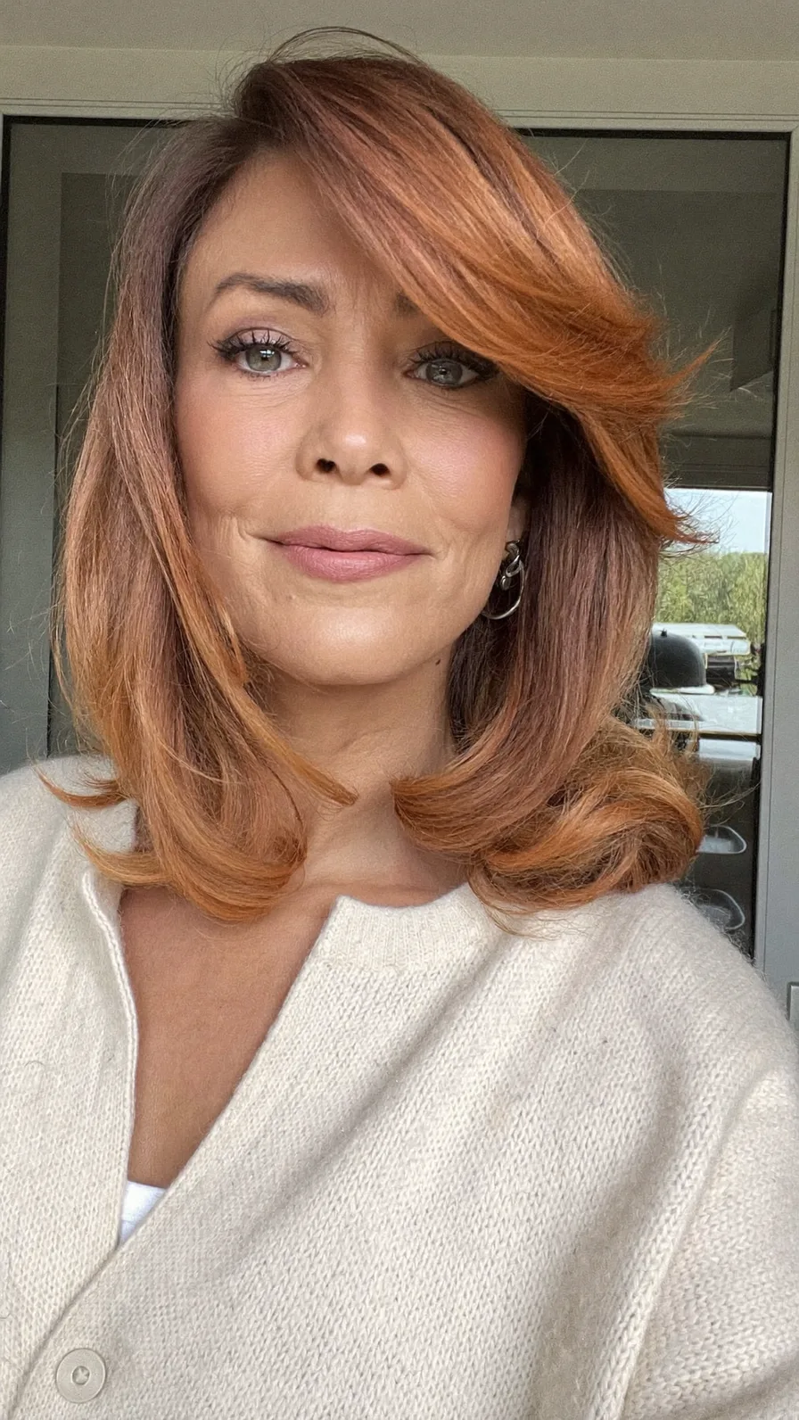 Classic Shoulder-Length Copper Auburn Hair with Flicked Ends