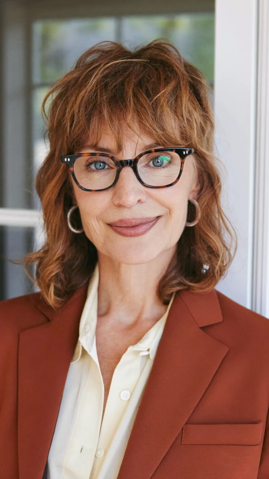 Modern Shoulder-Length Layered Shag with Wispy Bangs and Highlights