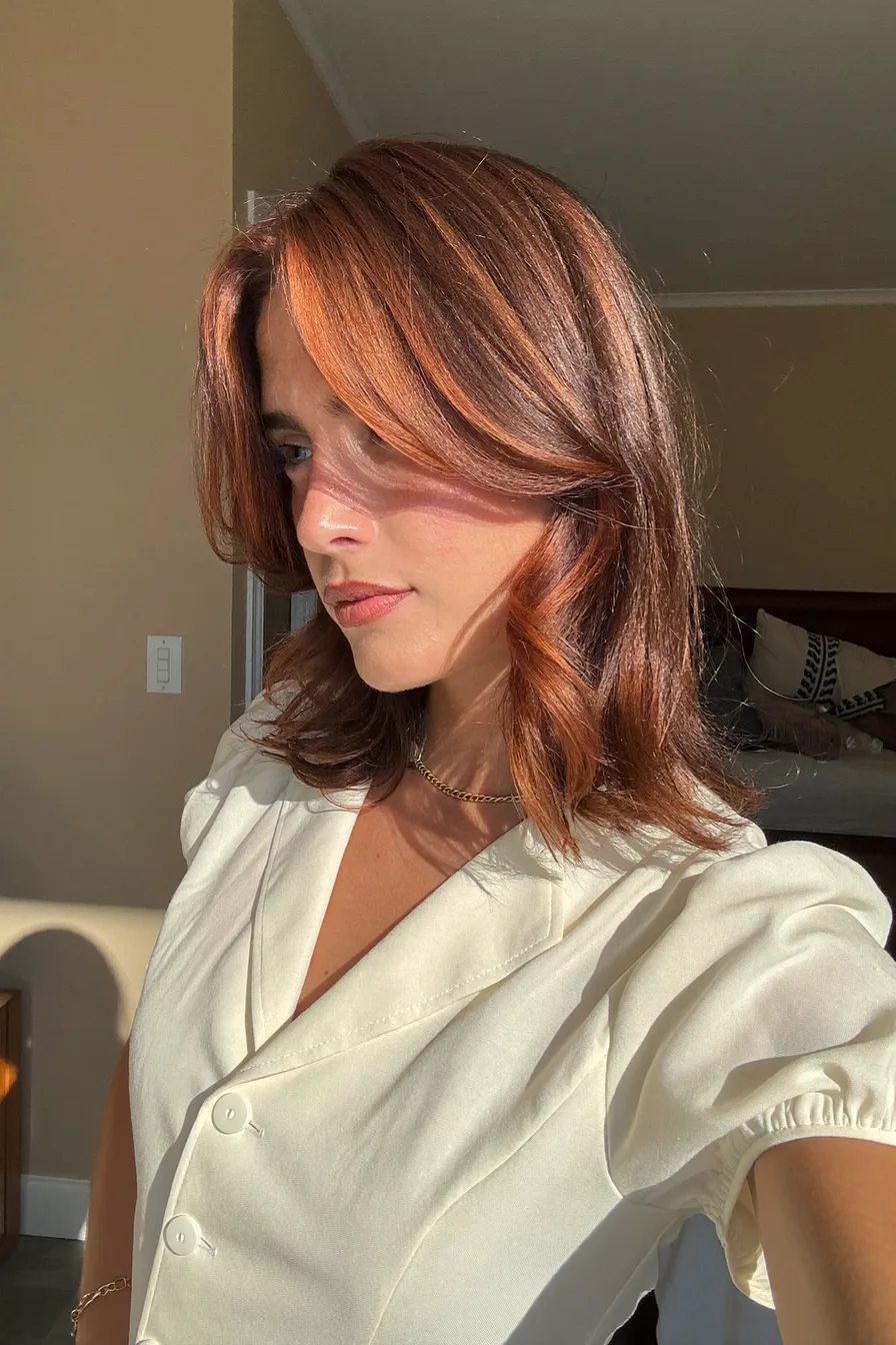 Layered Mid-Length Cowgirl Copper Waves with Face-Framing Highlights